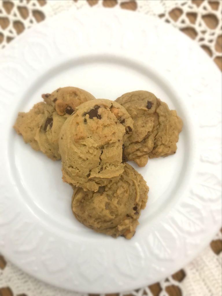 Three Butterscotch and Chocolate Chip cookies on a white plate