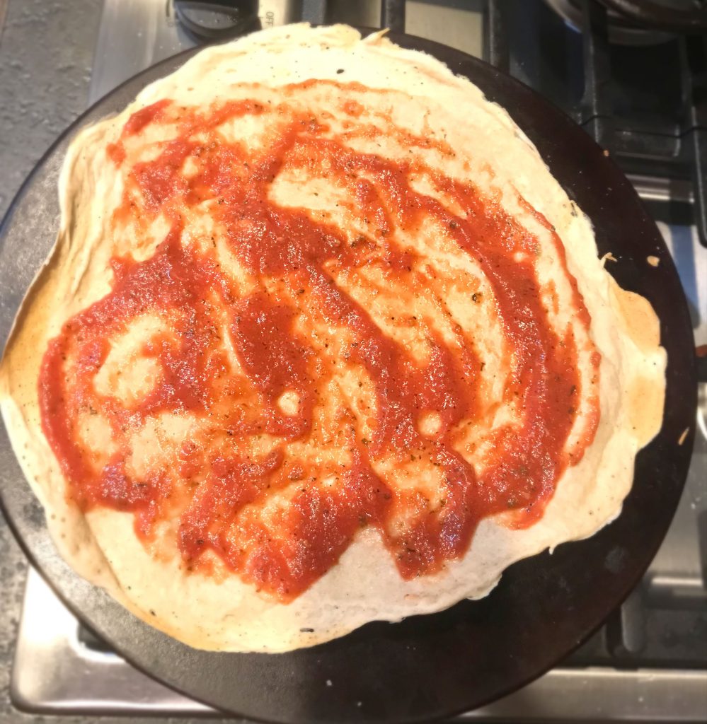 Homemade Pizza Sauce spread onto Sourdough pizza crust