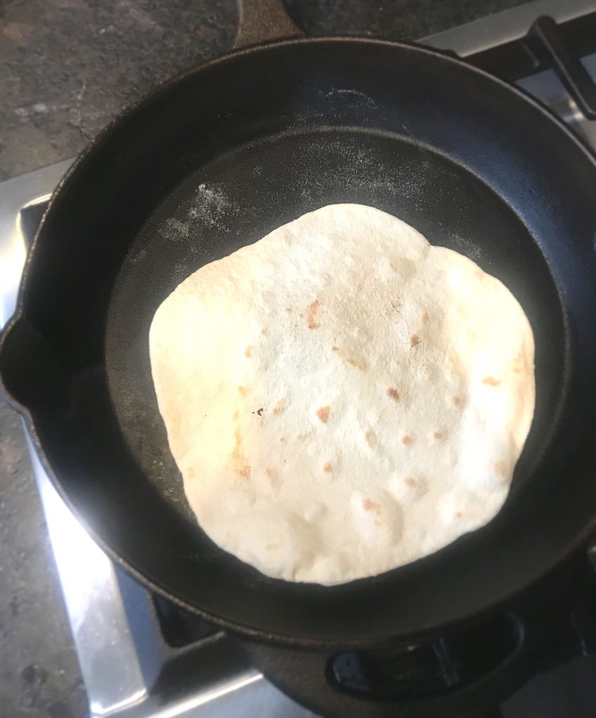 Homemade Sourdough tortilla in a Cast Iron skillet