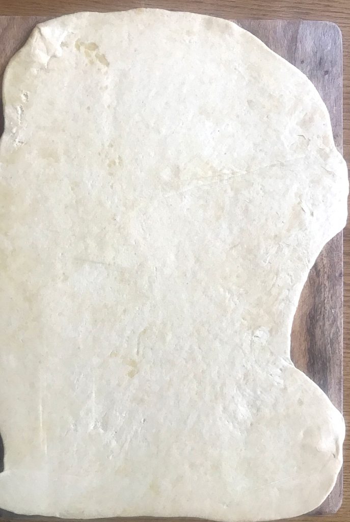 Dough rolled into a rectangular shape to 1/4 inch thickness