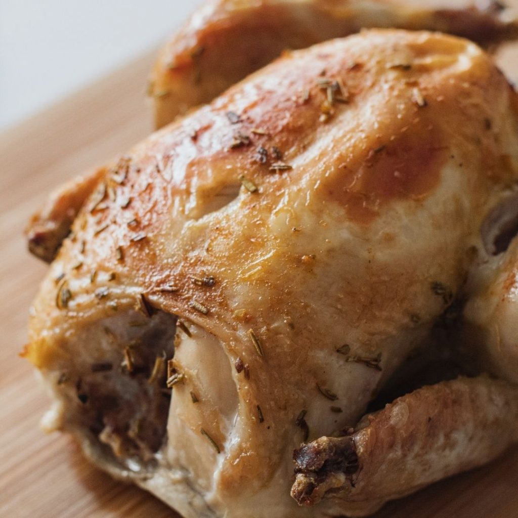 roasted whole chicken on a cutting board