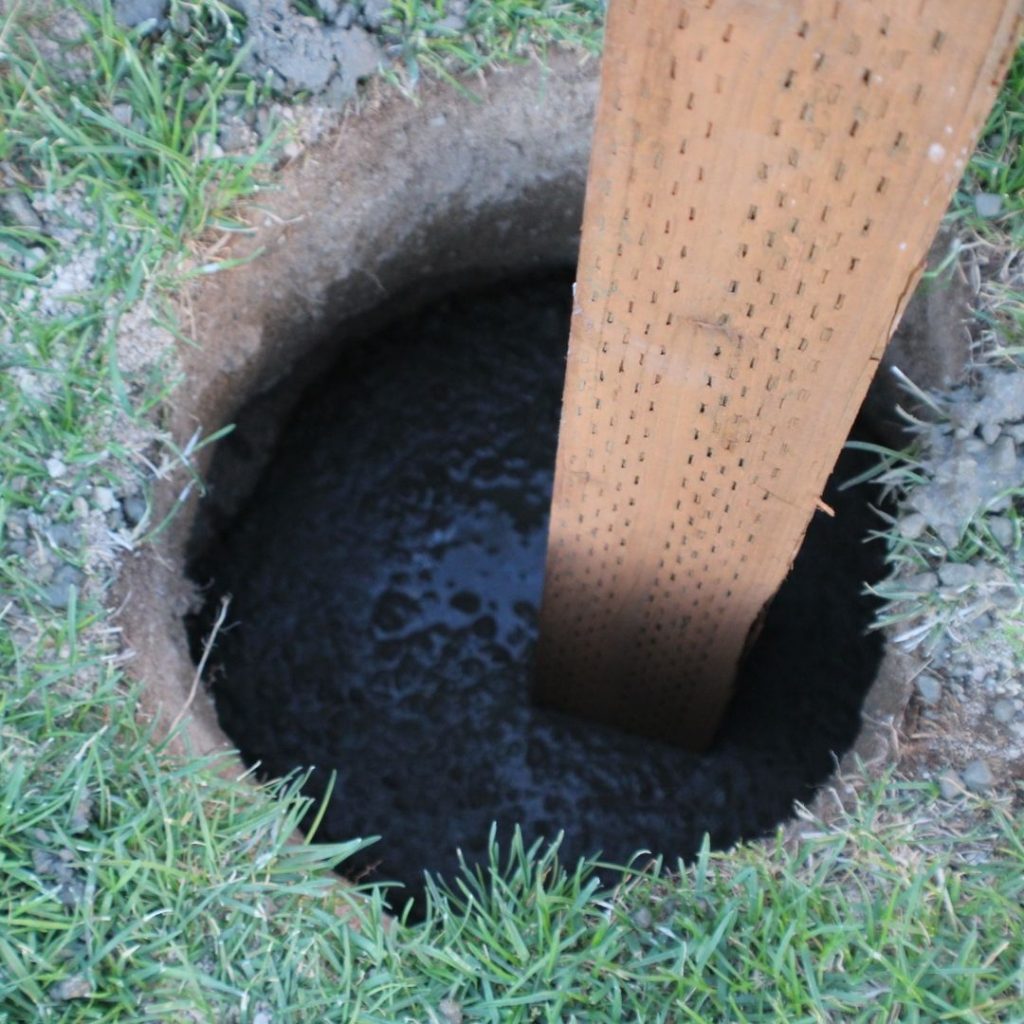 A post cemented in a hole