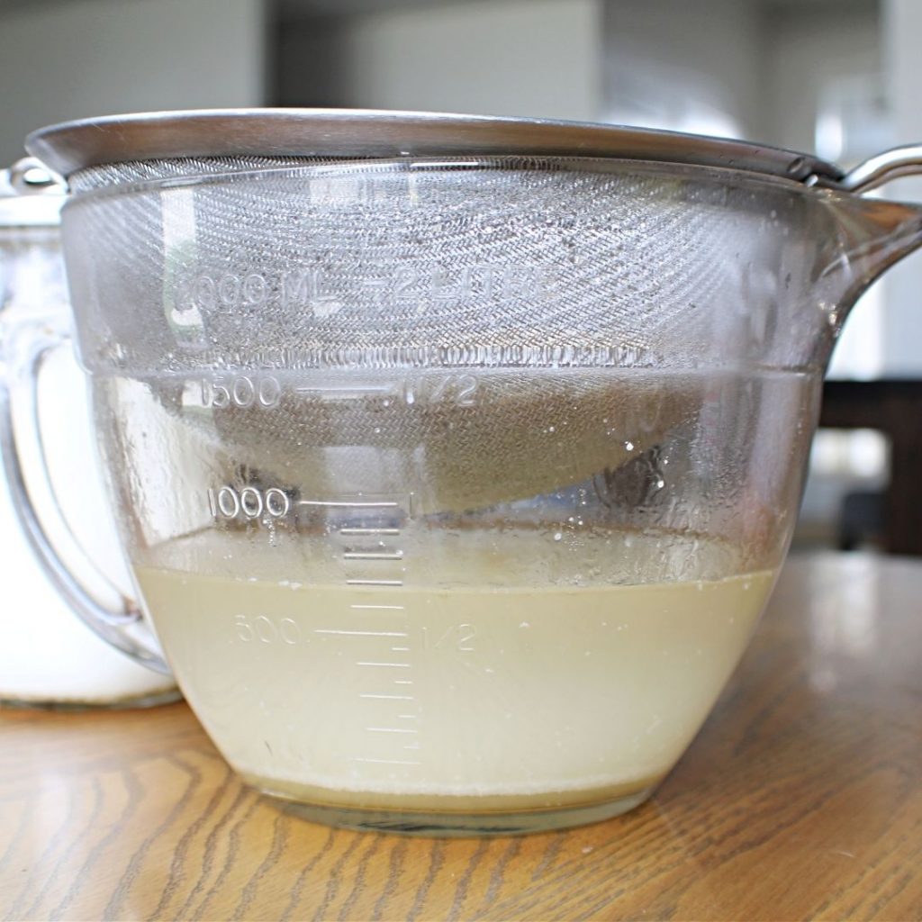 A bowl of Lard that has been strained through a colander after being rendered. 