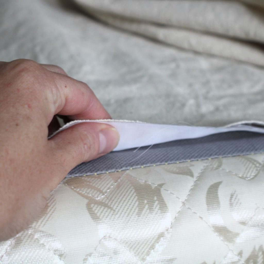 Woman's hand showing right sides together for pinning fabric