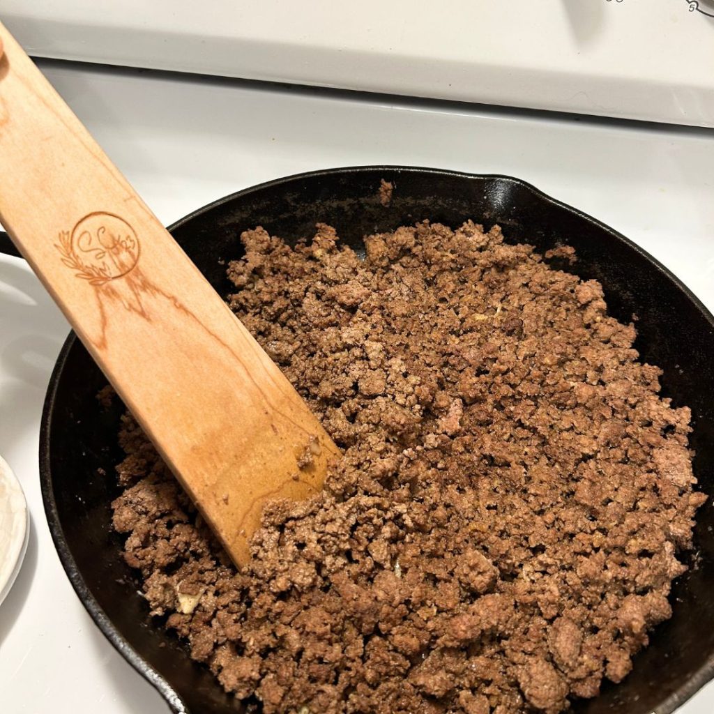 Cooked ground beef in a cast iron skillet